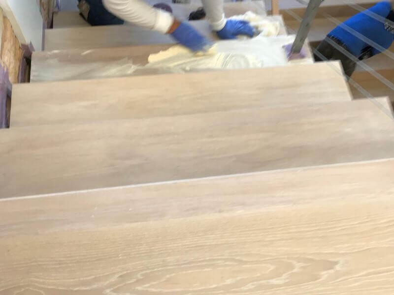 Water damaged hardwood floor before restoration - Malibu oceanfront home