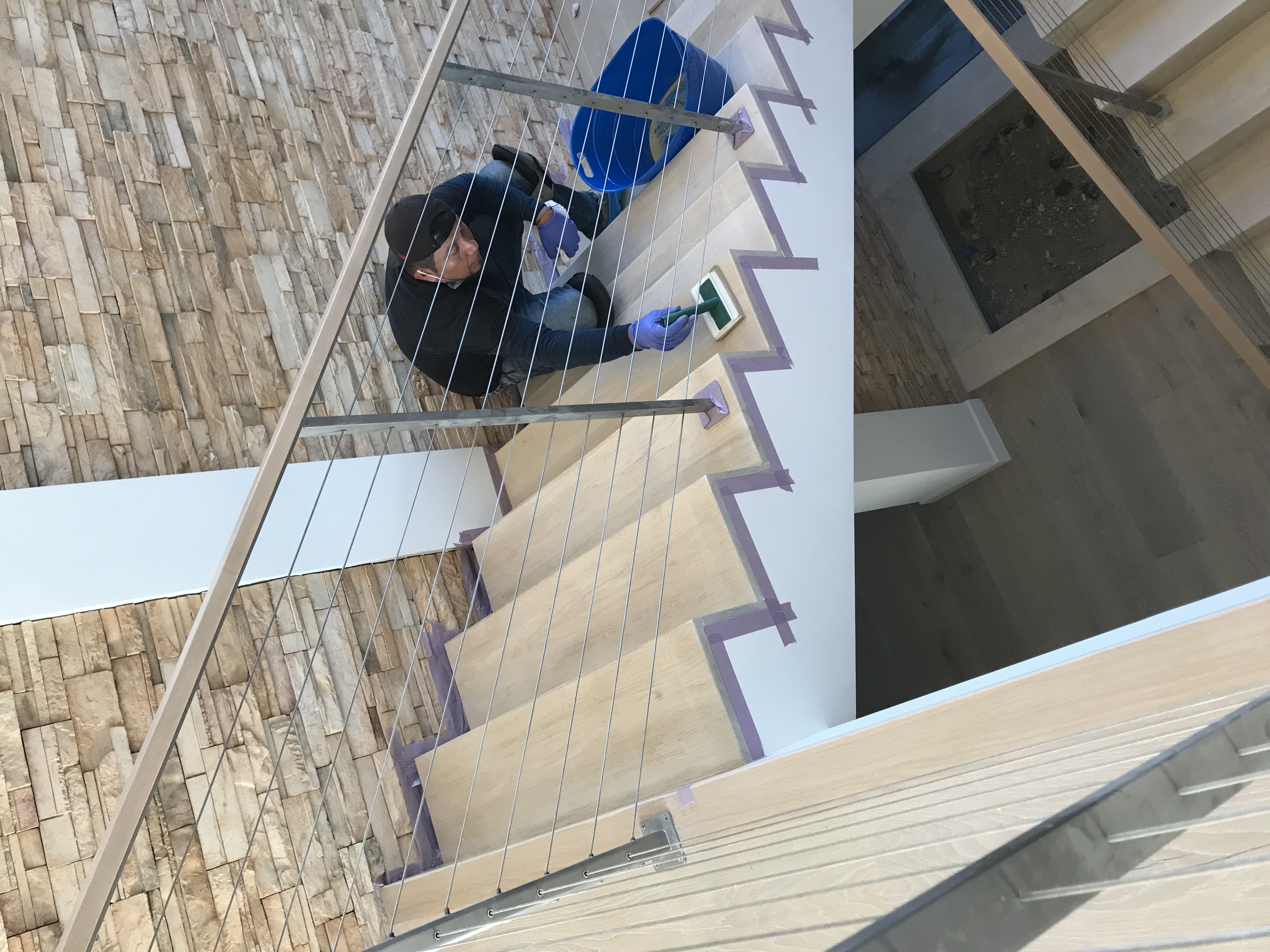 Worn hardwood floor before refinishing - Santa Monica beachside home