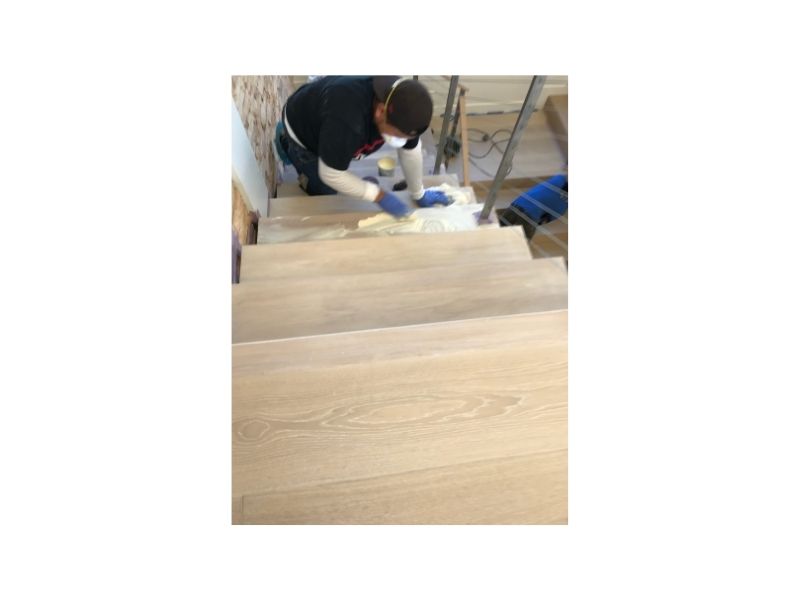 Water damaged hardwood floor before restoration - Venice beach house
