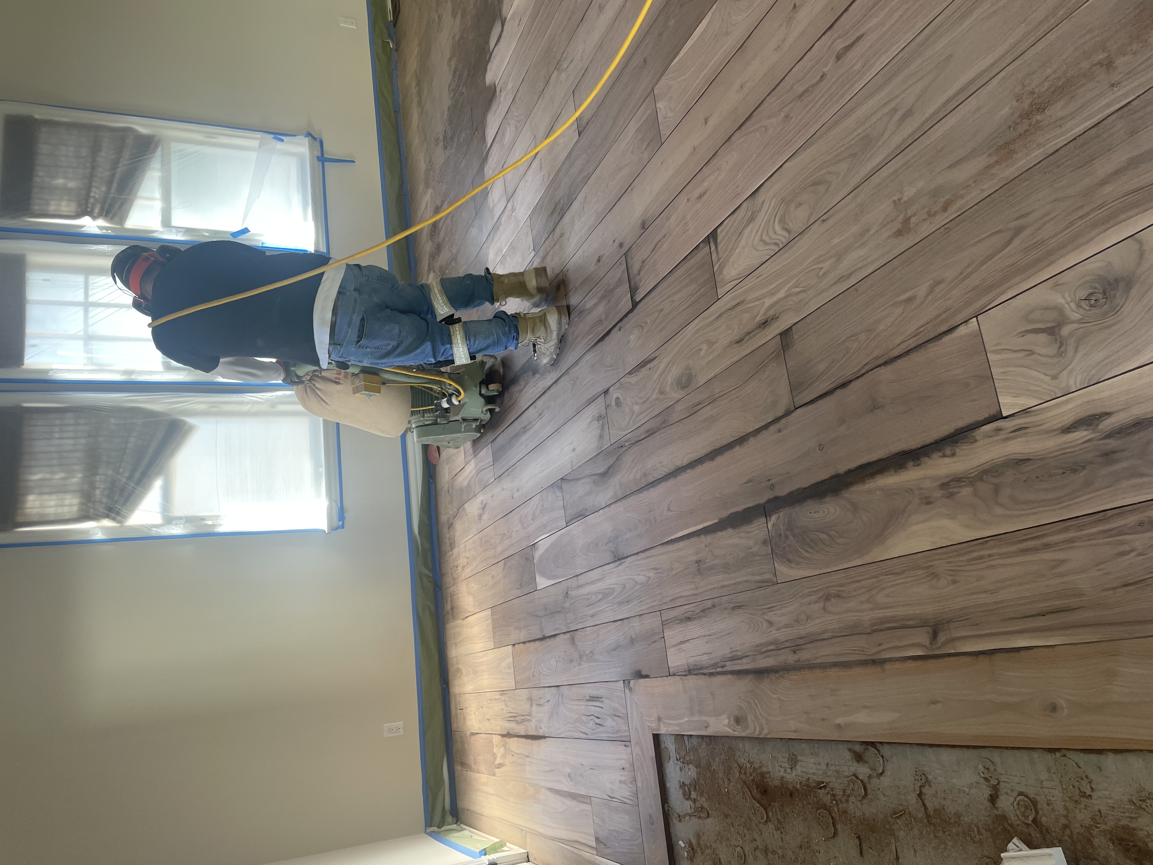 Hardwood floor before sanding - scratched and worn
