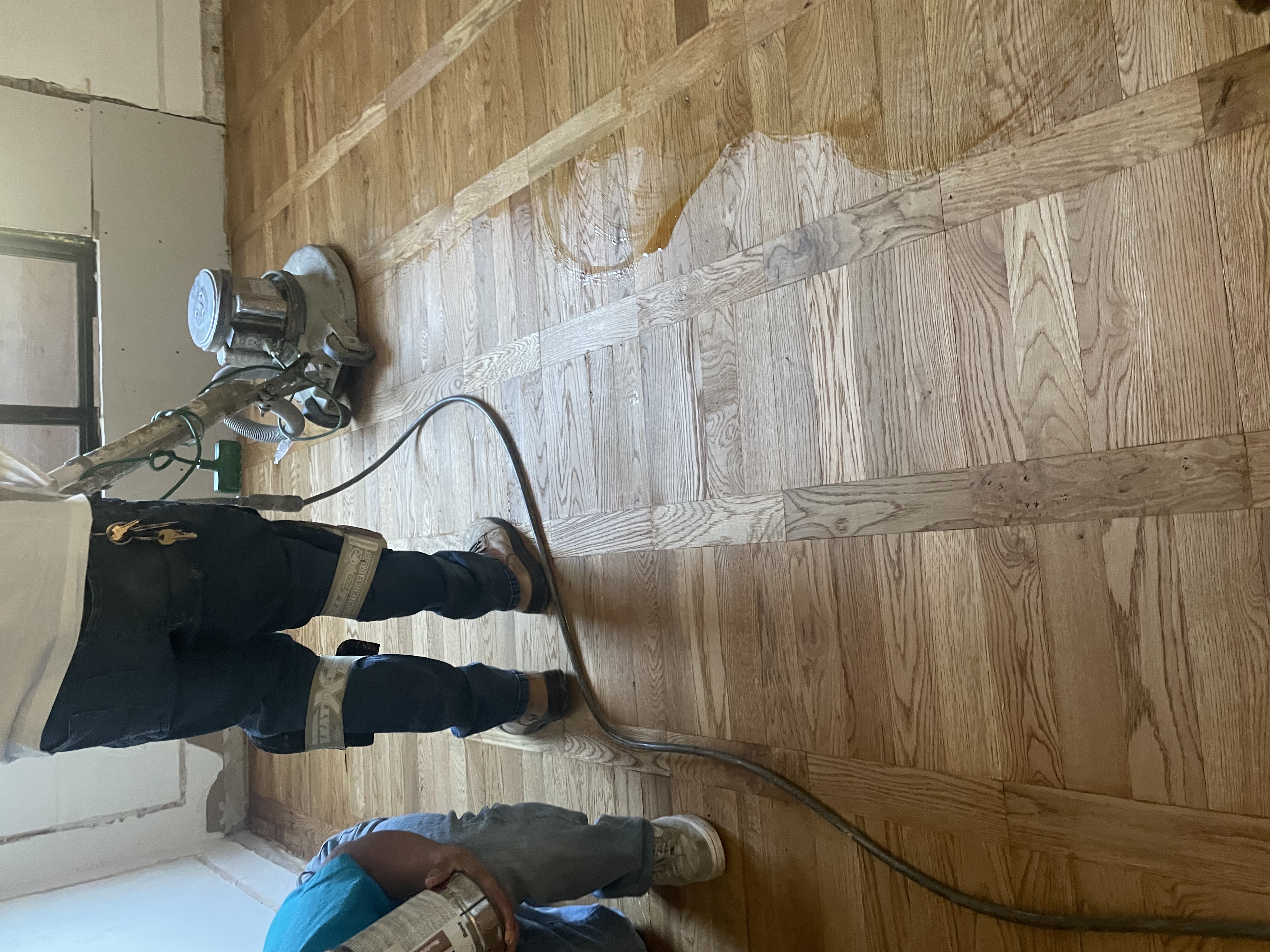 Hardwood floor before refinishing - worn and faded