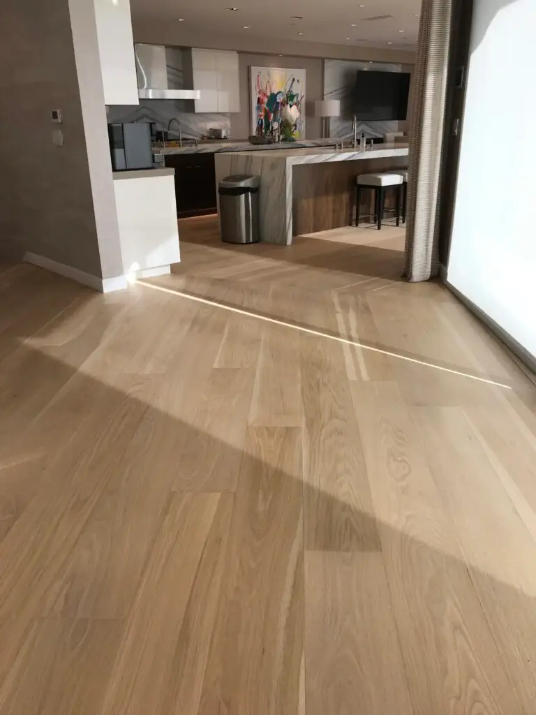 "Luxurious kitchen view with premium wood flooring, blending elegance and functionality in a modern San Diego home."